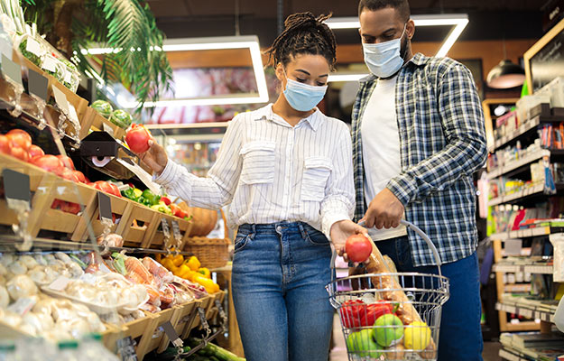 African couple doing shopping at a local grocery store | How To Get More Foot Traffic To Your Business