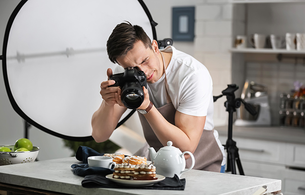 A cafe owner taking picture of the dessert | How Photos Can Increase Your Google My Business Listing Performance